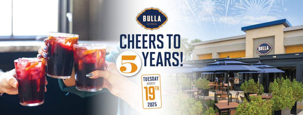 “Red sangría cheers at Bulla The Falls patio with fireworks — 5th anniversary celebration.”
