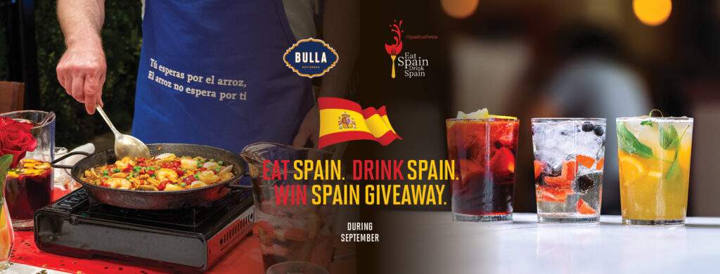 Eat Spain Drink Spain giveaway at Bulla Gastrobar featuring authentic Spanish paella and colorful cocktails.