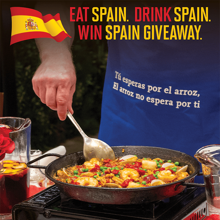 Eat Spain Drink Spain giveaway at Bulla Gastrobar featuring authentic Spanish paella and colorful cocktails.