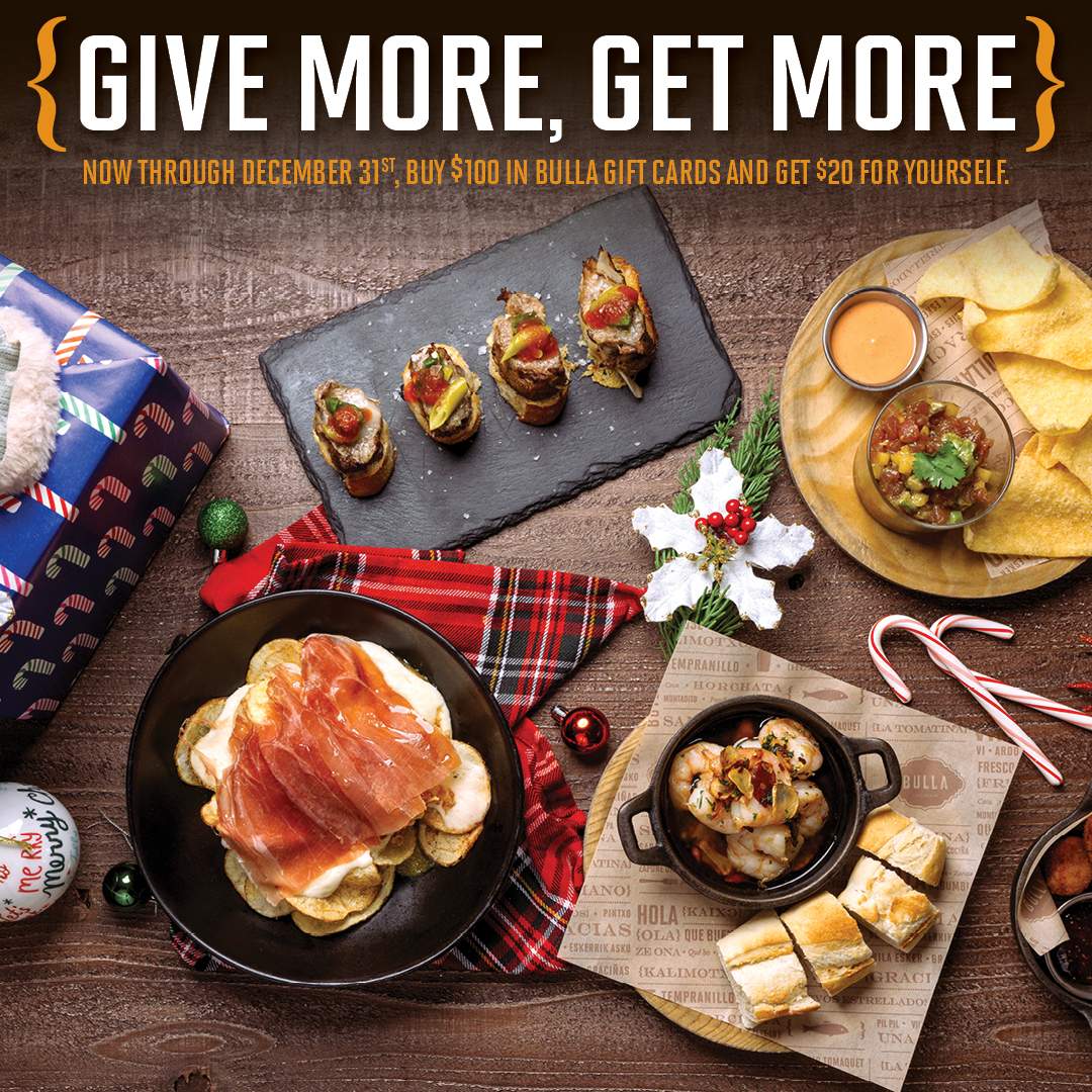 Bulla Gastrobar holiday promotion featuring Spanish tapas, gift cards, and festive décor with the “Give More, Get More” offer — buy $100 in gift cards, get $20 bonus.