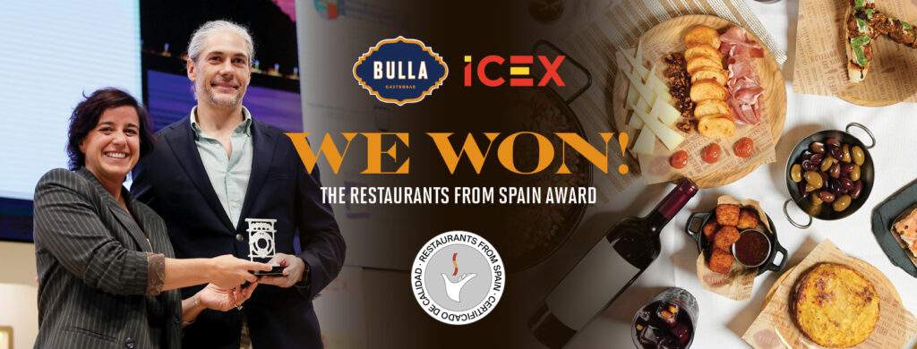 “Bulla Gastrobar receiving the Restaurants From Spain Award from ICEX, featuring the award presentation and a spread of authentic Spanish dishes.