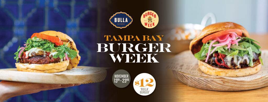 The Bulla Burger served during Tampa Bay Burger Week, featuring melted cheese, arugula, tomato, and pickled onions on a toasted bun at Bulla Gastrobar Tampa.