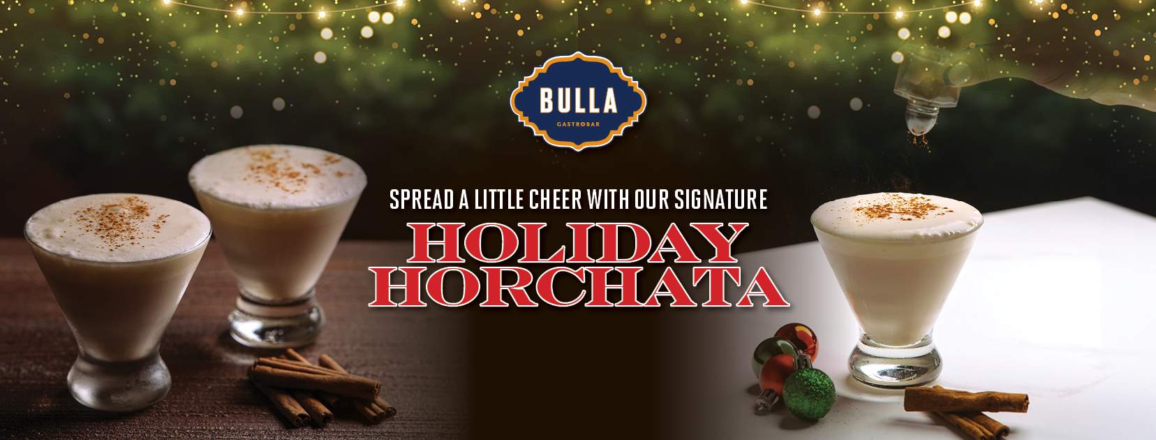 A festive glass of Holiday Horchata from Bulla Gastrobar topped with cinnamon, served in a cozy holiday setting."