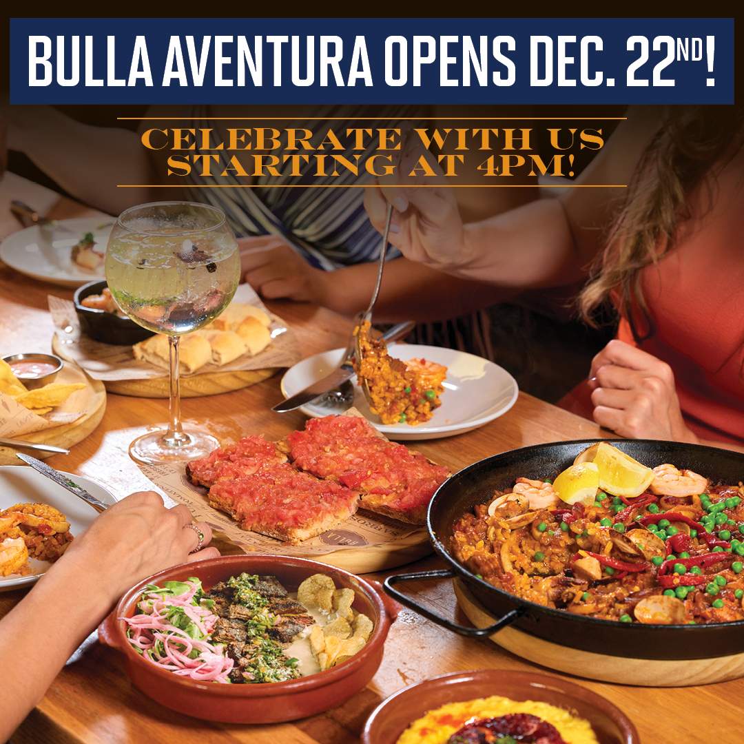 "Guests enjoying Spanish tapas and paella at Bulla Aventura grand opening on December 22nd with cocktail happy hour, patio paella tasting, and $20 gift card offer"