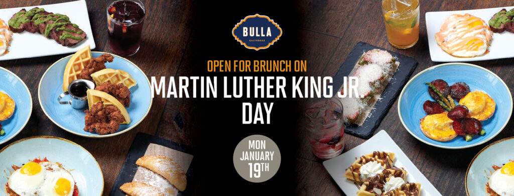 “Brunch table at Bulla Gastrobar with steak & eggs, blueberry pancakes, and drinks for Martin Luther King Jr. Day”
