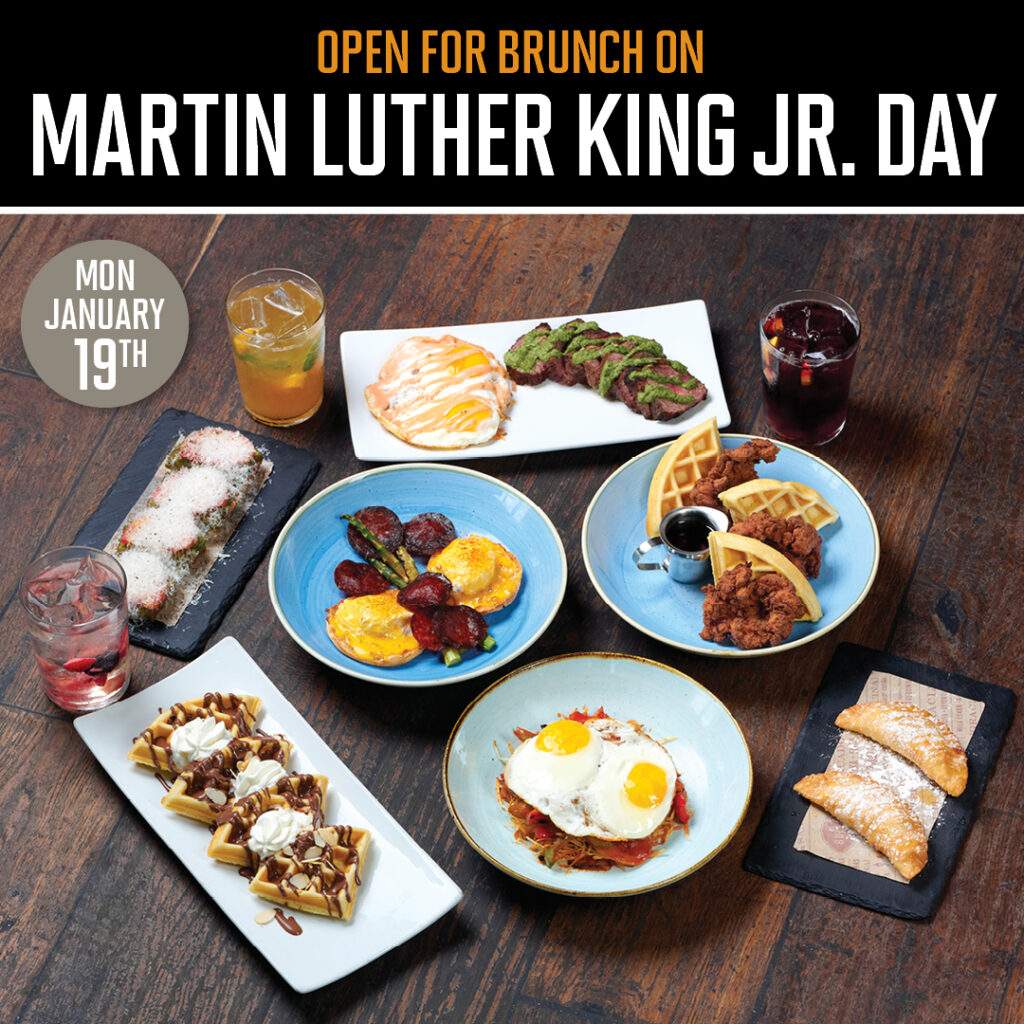 “Bulla Gastrobar’s MLK Day brunch spread featuring signature dishes and cocktails, including mimosas and sangrías.”