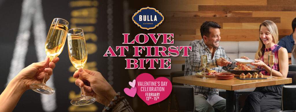 Couple enjoying a romantic San Valentine’s Day dinner at Bulla Gastrobar with a curated 4-course menu and champagne toast,