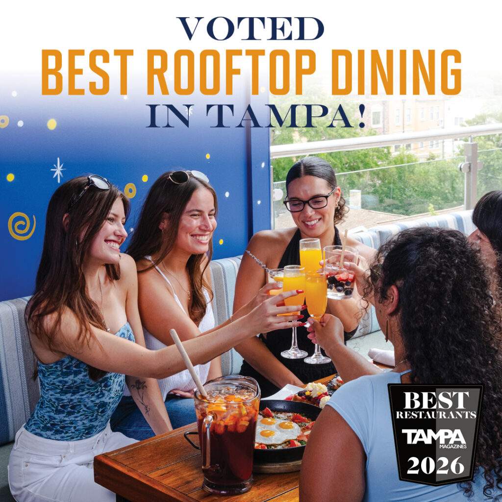 Group of friends enjoying drinks and tapas at Bulla Gastrobar Tampa’s award-winning rooftop, voted Best Rooftop Dining by Tampa Magazines 2026.