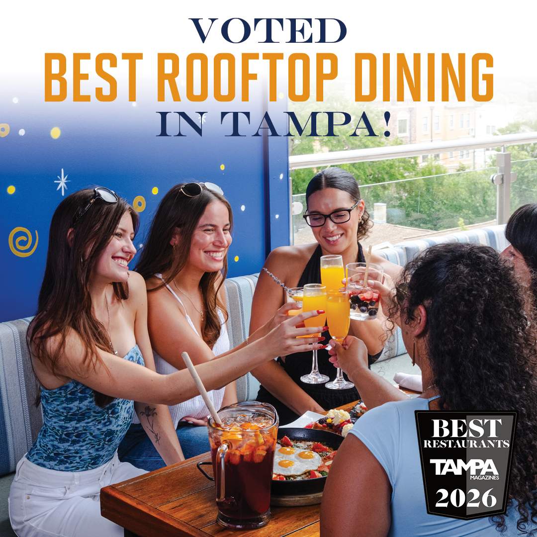 Group of friends enjoying drinks and tapas at Bulla Gastrobar Tampa’s award-winning rooftop, voted Best Rooftop Dining by Tampa Magazines 2026.