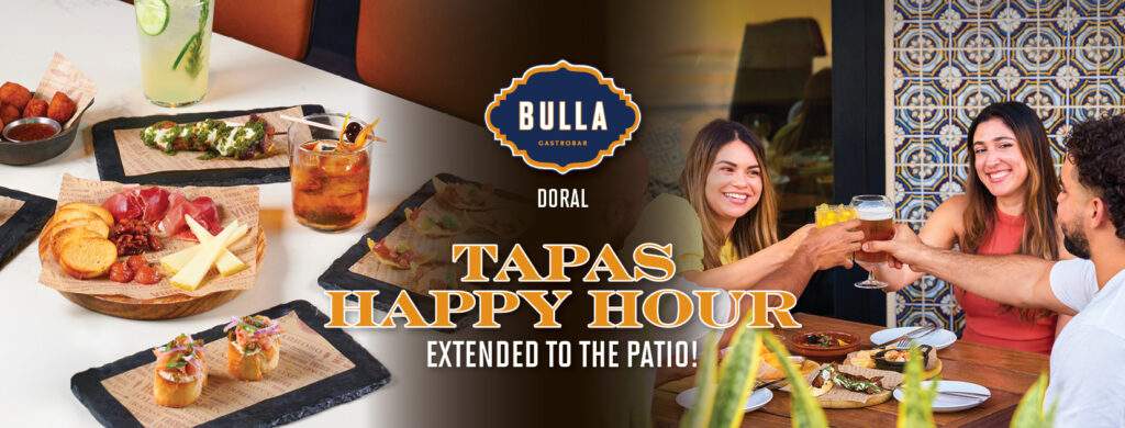 Friends enjoying tapas and drinks during happy hour on the patio at Bulla Gastrobar Doral.