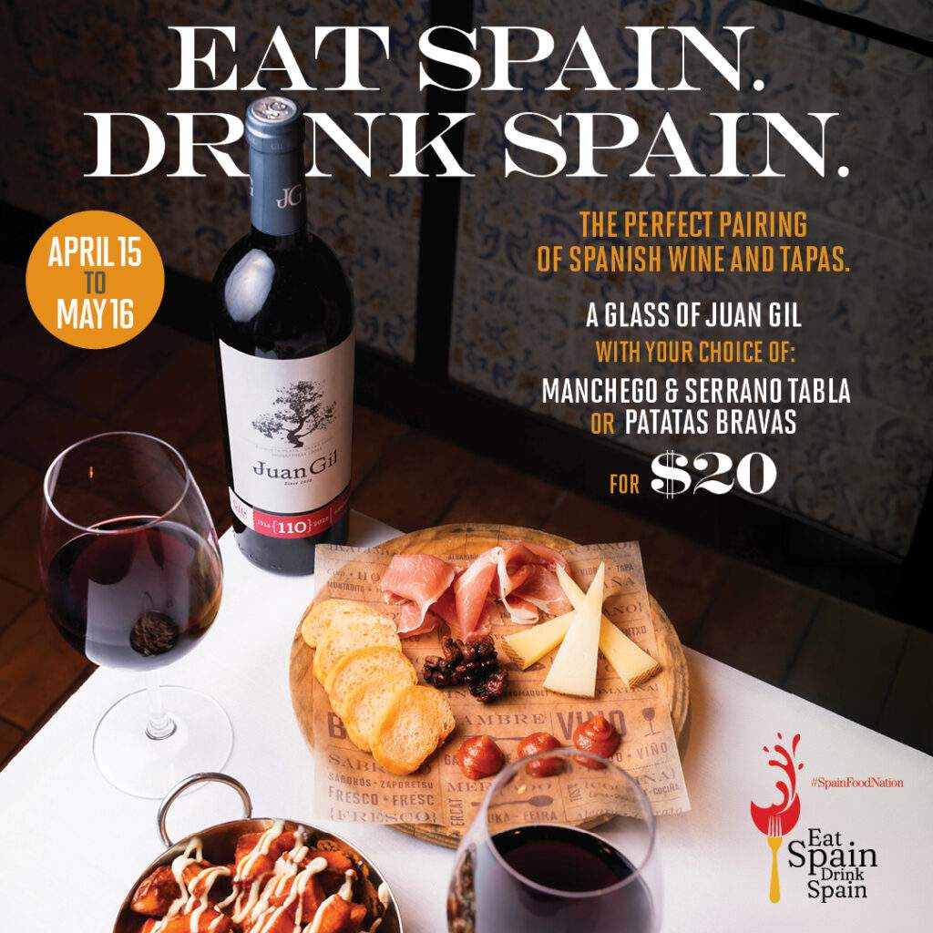 Spanish wine and tapas pairing at Bulla Gastrobar featuring Juan Gil wine, charcuterie board, and patatas bravas during Eat Spain Drink Spain promotion
