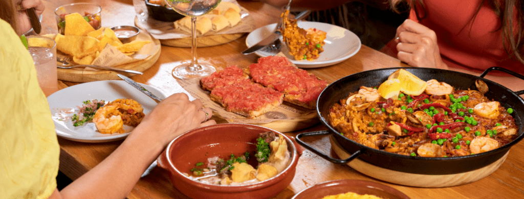 Selection of Bulla Gastrobar Spanish tapas served on a table, featuring shareable small plates with bold flavors and fresh ingredients.